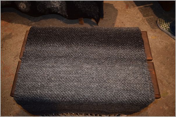 Gotland wool woven blanket on a bench. Photo: Peggy Lundquist.